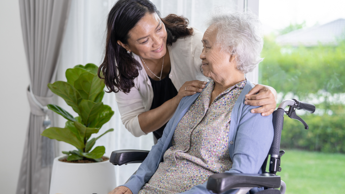 Carer with woman in wheelchair